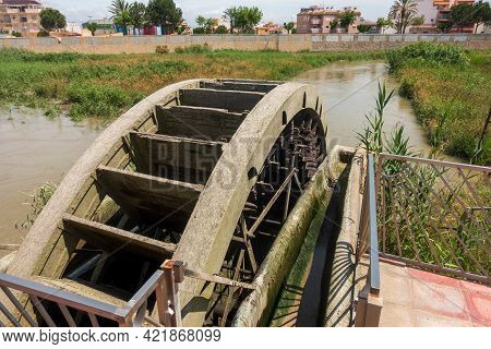 Water Wheel Pump Used To Provide Water For Orchard Irrigation