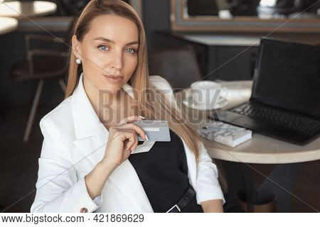 Business Woman Working With Laptop In Cafe, Holging Credit Card