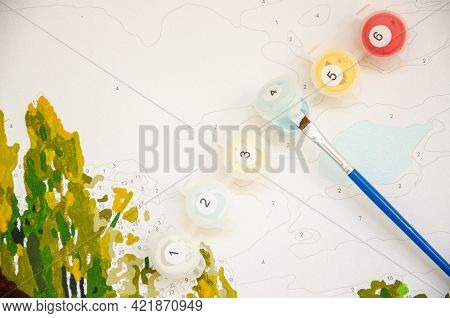 Selective Focus On Paints And Paintbrush For Painting By Numbers. Part Of The Painting By Numbers Wi