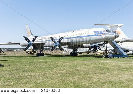 Russia, Moscow - May 1, 2021: Old Discommissioned Plane Tu 114 Stand In Field In Opened Air Museum. 