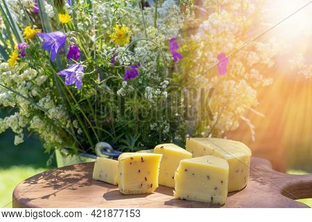 Sliced Cheese With Cumin On A Wooden Table. Celebration Of A Traditional Holiday In Latvia Ligo In J
