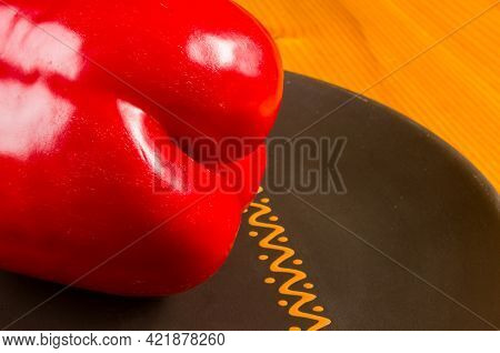 A Freshest Red Paprika, Bell Pepper In Ceramic Plate