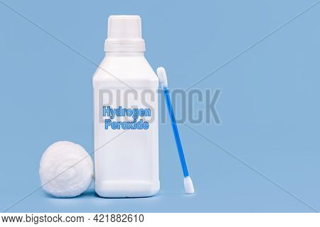 Plastic Container, Medicine Bottle, Written In English: Hydrogen Peroxide, Isolated Blue Background,
