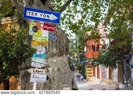 Kas, Turkey - November, 9, 2020 - Colorful Direction Signs On The Street Of Kas Town