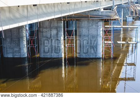 Flooded Bridge Spans. Springtime Flood Of The River. Huge Bridge Pillars And Long Spans. Massive Con