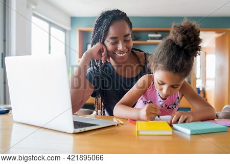A Mother Helping Her Daughter With Homeschool.