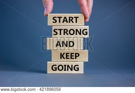 Start Strong And Keep Going Symbol. Concept Words 'start Strong And Keep Going' On Wooden Blocks On 