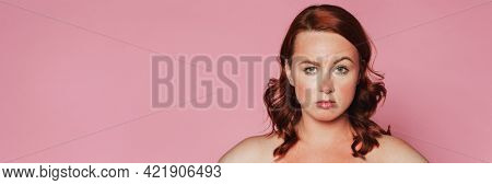 Skeptical woman with sunburnt skin