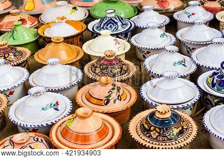 Colorful Ceramic Tagines For Sale. Typical Traditional Moroccan Ceramic Tagines In A Gift Store. Mor