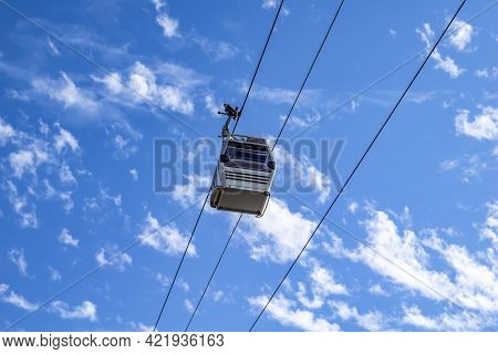 Cable Car Cabin Isolated On Blue Cloudy Sky Background - Bottom View. Funicular Railway In Alanya (t