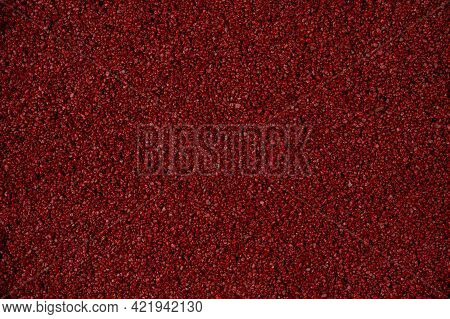 Background Image Of Sand And Pebbles Close-up. Red Pebbles And Grains Of Sand. Colored Sand For Desi