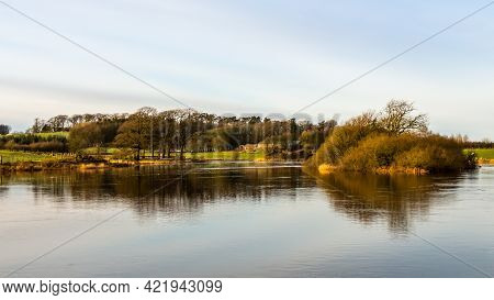 Reflection On The River Dee From Lamb Island On Threave Estate, On A Sunny Winter Day, Dumfries And 