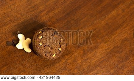 Tasty Chacolate Cookies Was Shot At My Home Using Tungsten Light Source On A Wooden Table. Very Tast