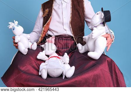 Actors With Moomin Troll Dolls On A Blue Background - Moscow, Russia, April 28, 2021