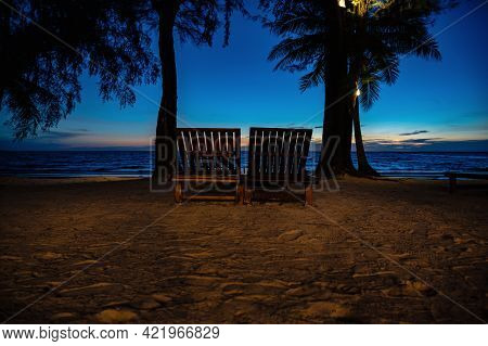 Wooden Chair Beside The Beach With Beautiful Idyllic Seascape Sunset View On Kohkood Island.koh Kood