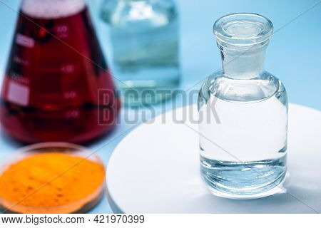 Reagent Bottle With Glass Stopper, Blue Background, Pharmacy Or Medicine Concept, With Copy Space