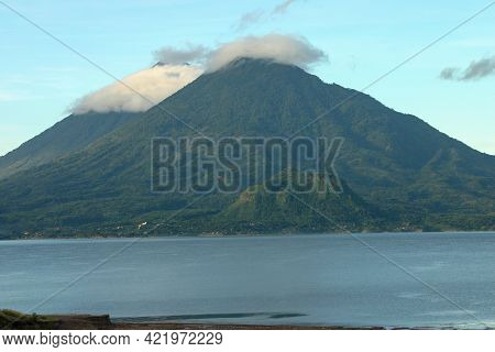 View Of The Volcanoes On Lake Atitlan Near Pananjachel Guatemala