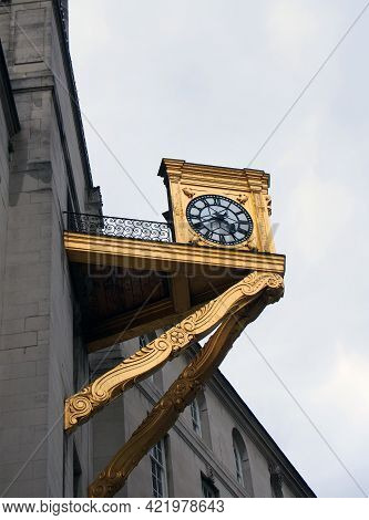 A Close Up Detail Of The Tower And Ornate Gold Clock On Leeds Civic Hall In West Yorkshire Against A