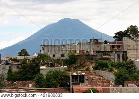 Solola, Guatemala, August 9, 2006: View Of The Volcano Atitlan And The Poverty In The Small City Of 