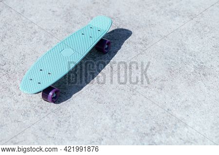 Skateboarding On The Road Streeet In City