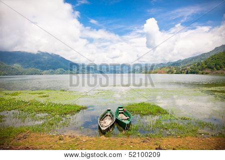 Boating is a major tourist attraction on Fewa (Phewa) lake in Pokhara, Nepal. One of the most beautiful Lakes of Pokhara Valley is the well-known Phewa Lake.