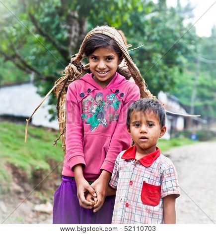 POKHARA - MAY 23: Nepalese carry things in big basket at the traditional way, on May 23, 2013 in Pokhara, Nepal. 