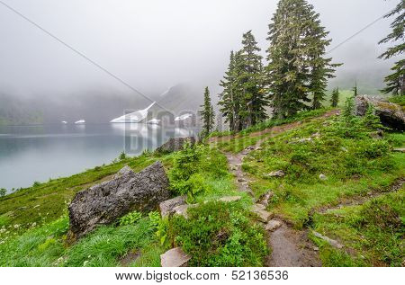 Fragment of foggy and rainy Bagley Lakes Trail at Mount Baker Park in Washington, USA