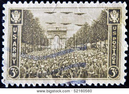 stamp printed in USA show USA Army on the Champs Elysees under the Arc de Triomphe in Paris