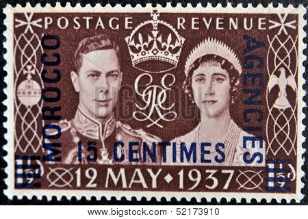 stamp printed in Great Britain showing an image of the coronation of George VI with queen Elizabeth