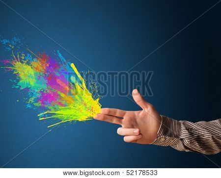 Colored splashes are coming out of gun shaped hands