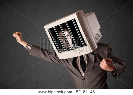 Business man with monitor screen on his head traped into a digital system concept