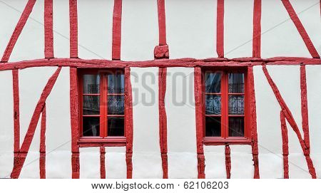 White and red half-timbered house detail