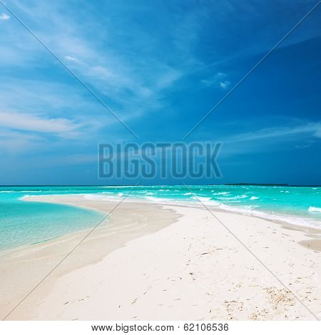 Beautiful island beach with sandspit at Maldives