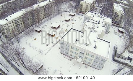 Kindergarten in residential district Bogorodskoe at winter in Moscow. Aerial view
