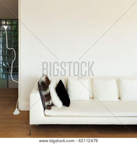 beautiful interiors of a modern house, living room, white divan