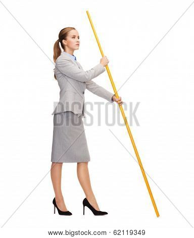 business and advertisement concept - calm woman holding flagpole with imaginary flag