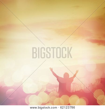 Man holding arms up in praise