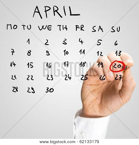 Man Marking Off Easter Day On The Calendar