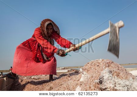 SAMBHAR, INDIA - NOVEMBER 19, 2012: Women mining salt at lake Sambhar, Rajasthan, India. Sambhar Salt Lake is India's largest inland salt lake