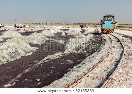 SAMBHAR, INDIA - NOVEMBER 19, 2012: Women mining salt at lake Sambhar, Rajasthan, India. Sambhar Salt Lake is India's largest inland salt lake