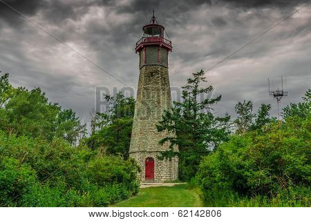 An Abandoned Lighthouse In A Cloudy Day