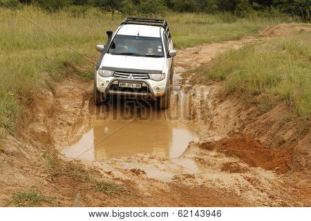 White Toyota Triton Dhd Crossing Mud Obstacle
