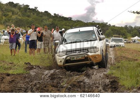 White Toyota Triton Dhd Crossing Mud Obstacle