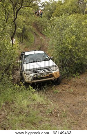 White Toyota Triton Dhd Crossing Mud Obstacle