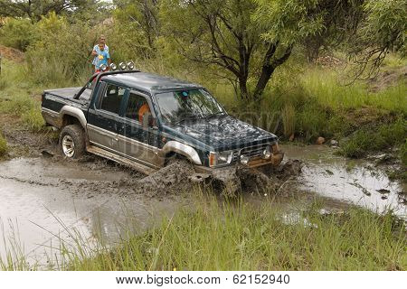 Viridian Green Mitsubishi Colt Rodeo Twin Cab Crossing Muddy Pond