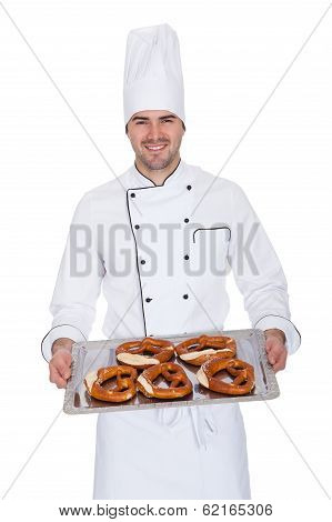 Portrait Of Happy Bakerman With Tray