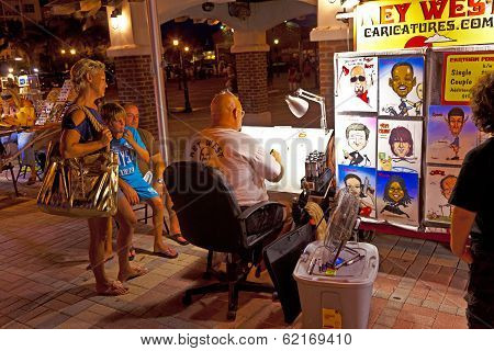 tourists enjoy Mallory Square atmosphere after sunset
