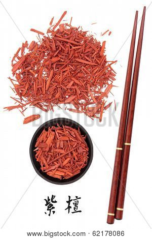 Sandalwood chinese herbal medicine and chopsticks with mandarin script title translation. Tan xiang. Santalum album.