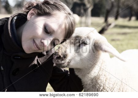 Young Woman Leaning Head On Sweet Lamb, Light Filters