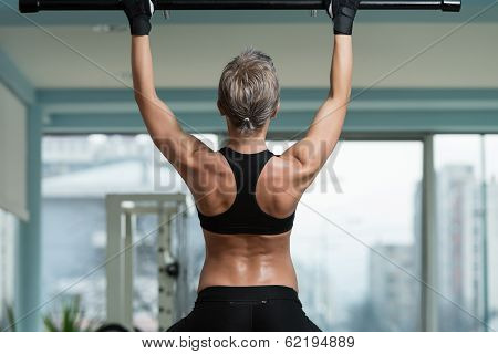 Female Athlete Doing Pull Ups
